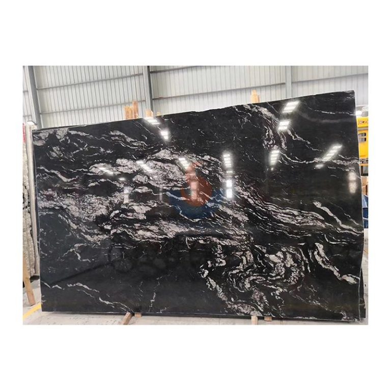 Full slab of Brazilian Black Cosmic Granite featuring white and silver swirling veins on a black background by Caron Stone