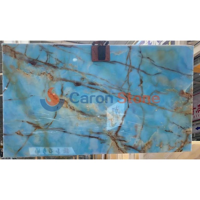 Full jumbo slab of polished Blue Onyx featuring a rare sky-blue background and golden-brown organic veining, supplied by Caron Stone.