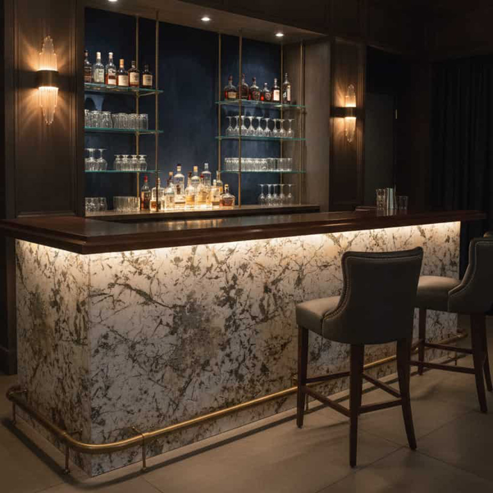 Glowing Backlit Patagonia Stone Bar A luxury hotel bar featuring a glowing front fascia clad in backlit ultra-thin Patagonia Quartzite composite panels.