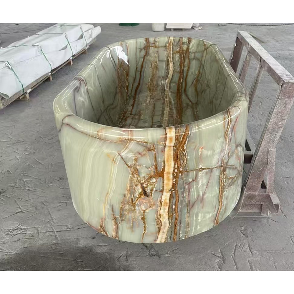 Translucent green onyx freestanding bathtub with polished finish and gold veining