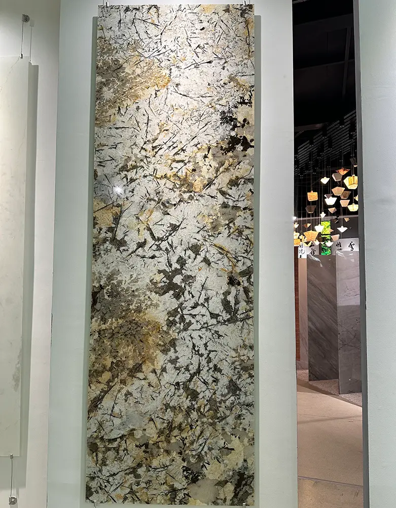 Large-Format Backlit Patagonia Stone Wall A massive double-height feature wall in a corporate lobby made from backlit, ultra-thin Patagonia Quartzite panels.