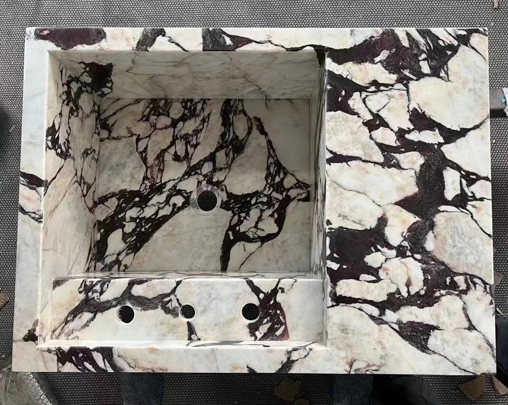 CNC Fabrication of Custom Marble Sinks State-of-the-art 5-axis CNC machine precisely cutting and milling an integrated basin out of a Calacatta Viola marble slab.