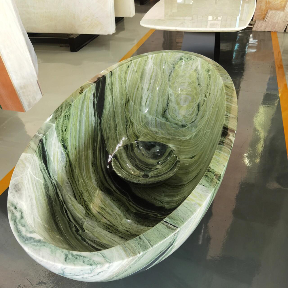 freestanding soaking tub carved from Green Rainbow stone