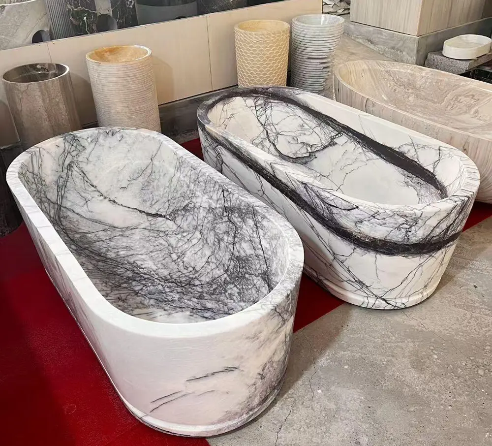 raw-lilac-marble-block-sourcing-caron-stone Massive raw blocks of natural Lilac White marble in the Caron Stone factory yard, selected specifically for carving solid bathtubs.