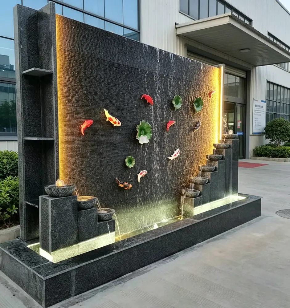 Close-up of water cascading smoothly over the grooved, ribbed texture of the dark artificial stone fountain wall.